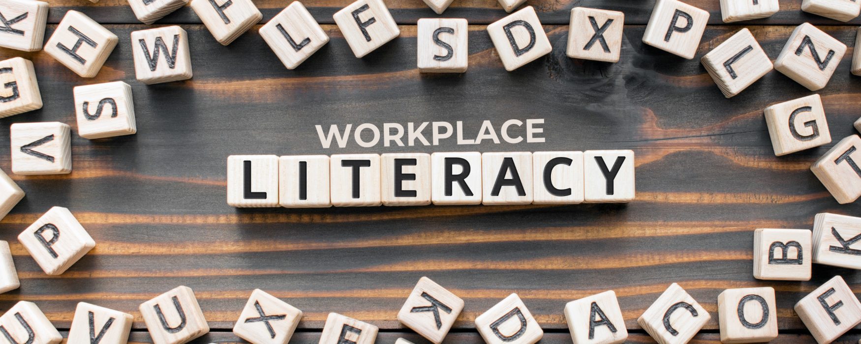 Image of lettered wooden blocks that spell out the words workplace literacy