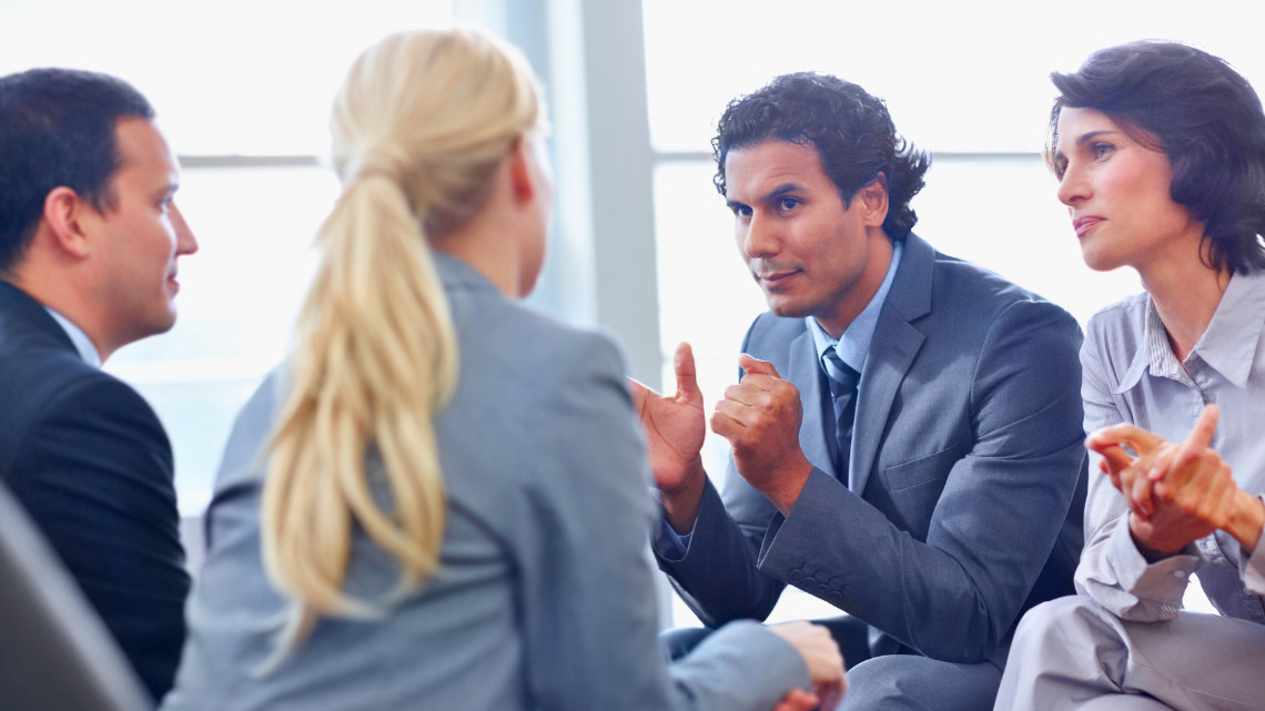 Group of coworkers exhibiting political differences