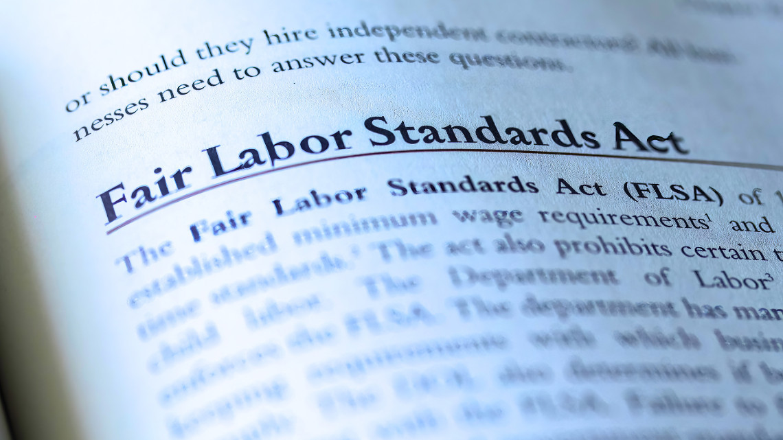 A page in a book talking about salary and the Fair Labor Standards Act (FLSA)