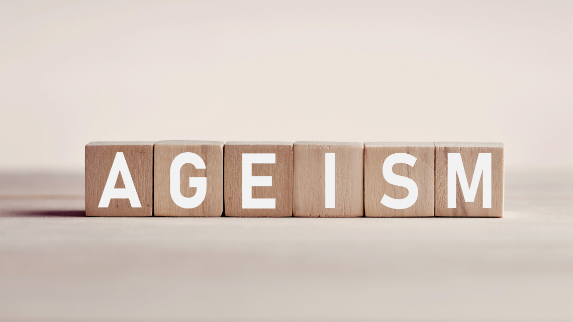 The word 'ageism' spelled out on wooden blocks