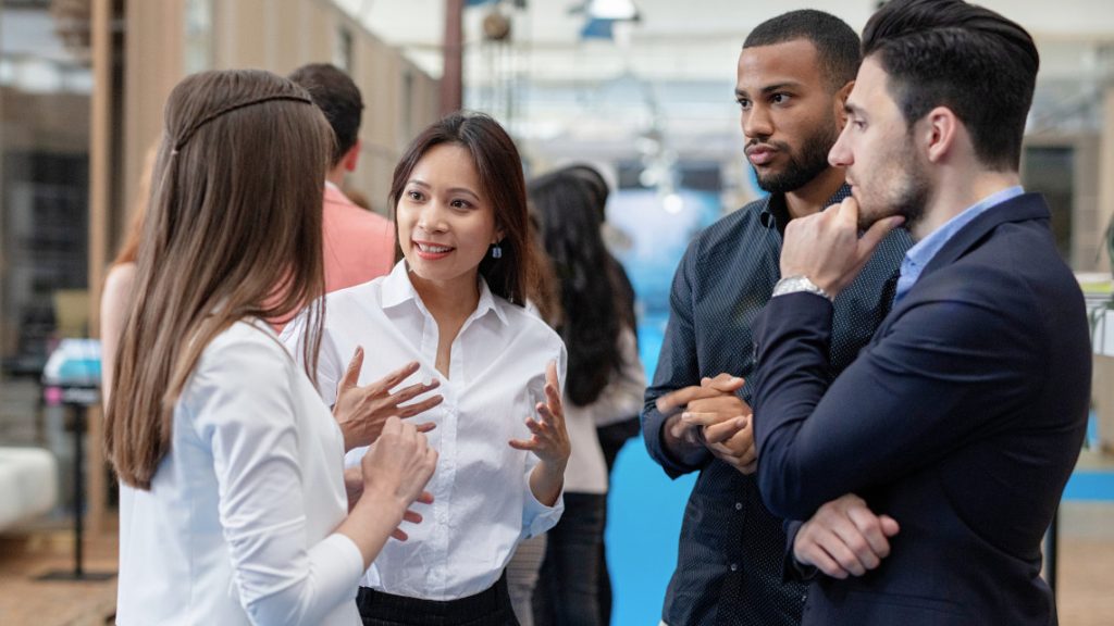 people standing in a peer community or professional network