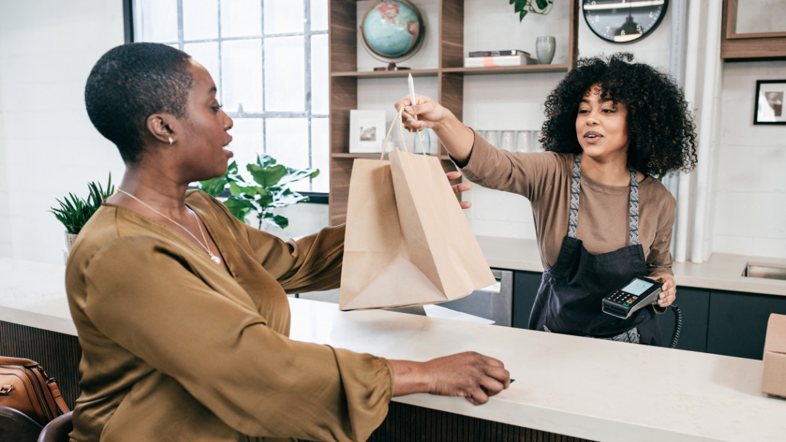 placeholder image of two people in a retail setting, relative to right to sit