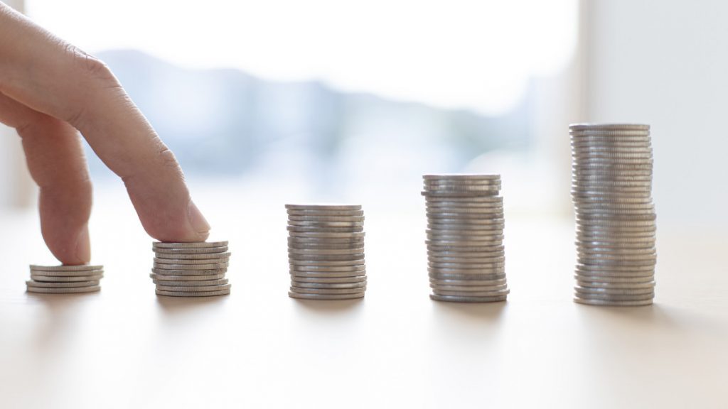 placeholder image of stacks of coins for article on wages and inflation