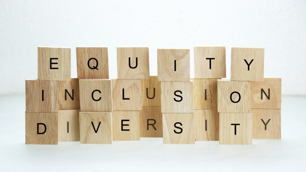 Wooden blocks that spell out diversity, equity and inclusion (DEI)